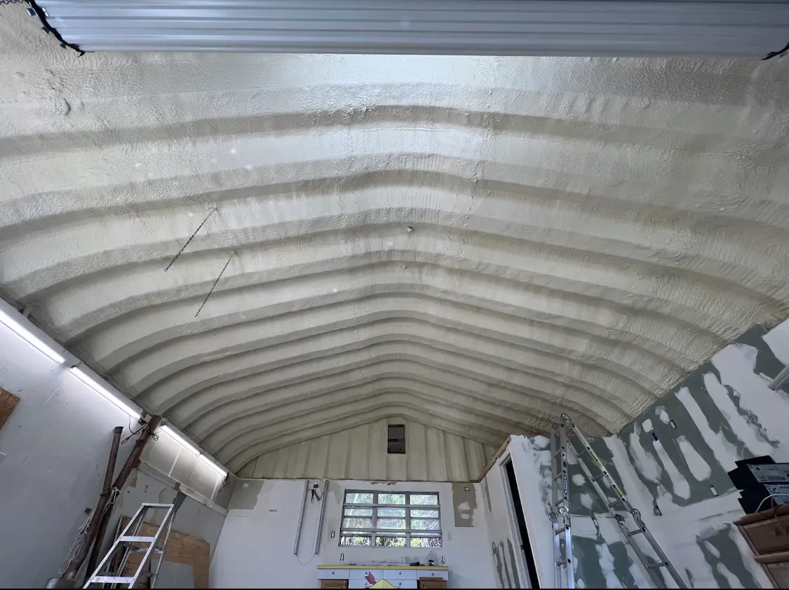 Spray polyurethane foam applied to the underside of a metal roof deck in Beloit